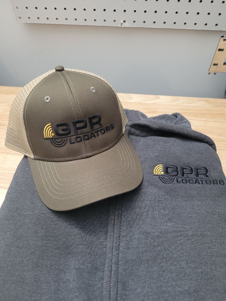 Trucker cap and hoodie with matching embroidered logo
