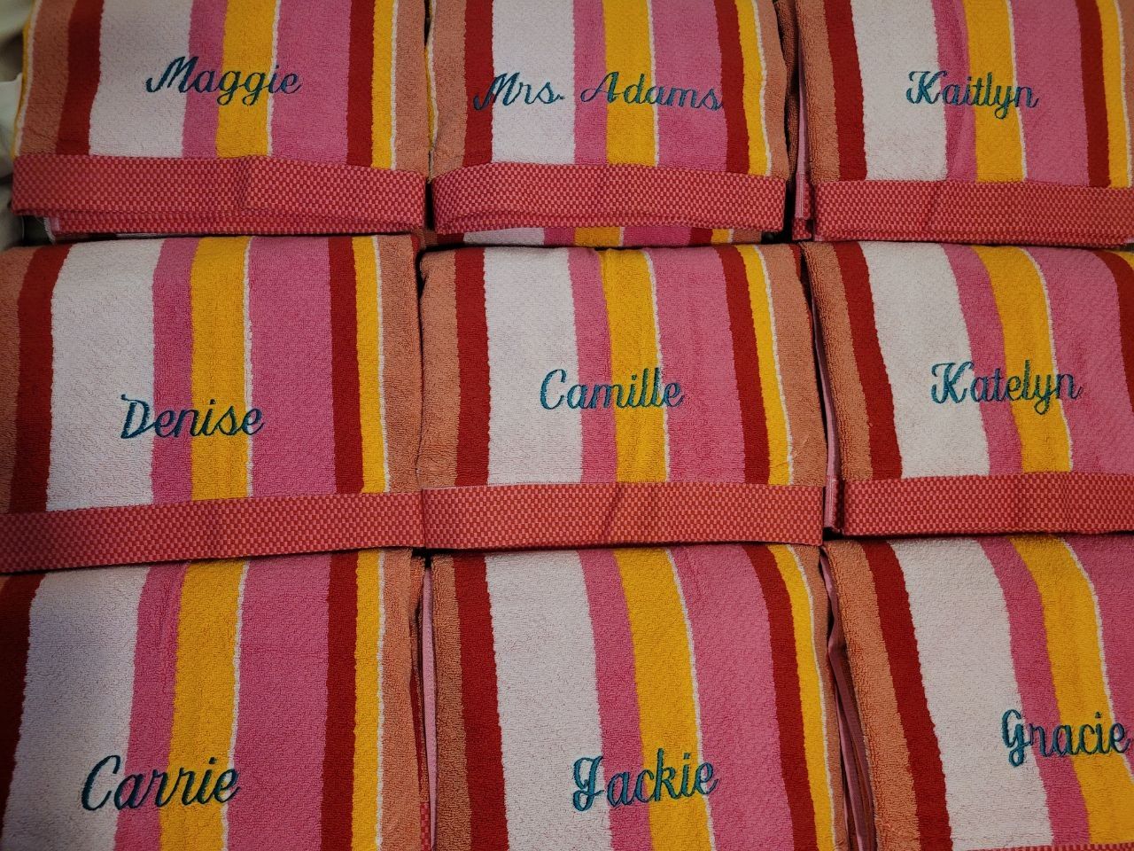Striped towels personalized with names in script embroidery