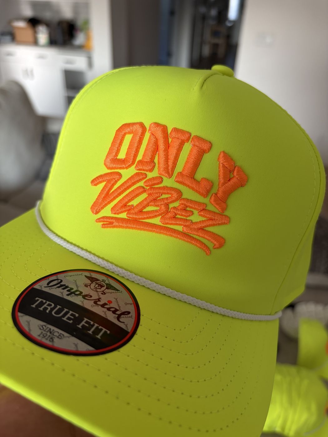 Neon yellow rope hat with orange 3D puff embroidery